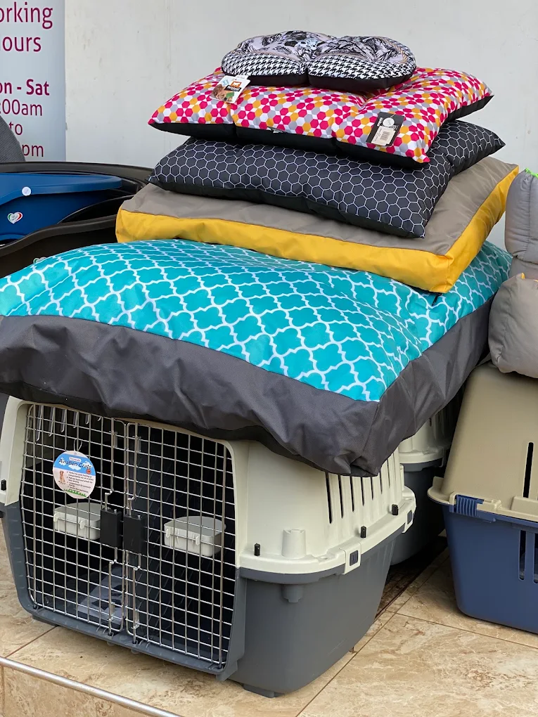 Pet beds and travel crates on display at PetWorld